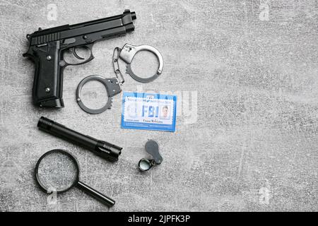 Identification document of FBI agent and accessories on grunge background Stock Photo