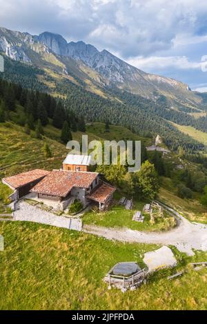 Baita Cornetto and the new bivouac, under the Presolana mountain, Castione della Presolana, Val Seriana, Bergamo district, Lombardy, Italy. Stock Photo