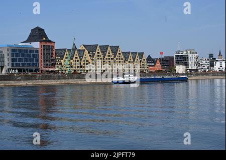 Cologne, Germany. 13th Aug, 2022. Cologne city view, The warehouses in the Rheiauhafen, Rhine with low tide Credit: Horst Galuschka/dpa/Alamy Live News Stock Photo