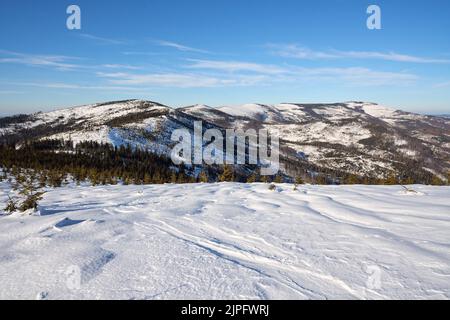 Beautiful Silesian Beskid Mountains view near european Bialy Krzyz in Poland, clear blue sky in 2022 cold sunny winter day on February. Stock Photo