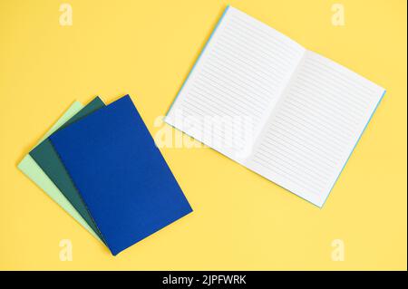 notebook on bright yellow background from above Stock Photo