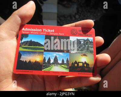 Magelang, INDONESIA, 20 May 2015 - A man's hand holding Admission Ticket of Borobudur Temple for adult visitors Stock Photo