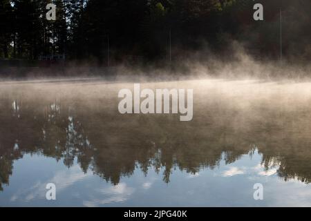 water vapor on the pond surface Stock Photo