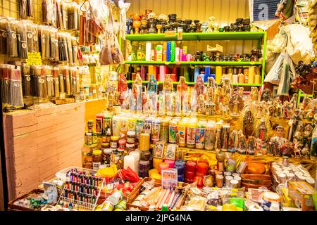 Candles, lighters, incense and ornaments being sold at Coyoacan Market in Mexico City, Mexico Stock Photo