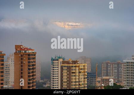 Lettering of the Terra Mitica amusement park shows through the fog over Benidorm, Spain Stock Photo