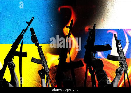 Two enemy flags and combat military assault rifles AK 74 and AK 74U on their background in destruction and fire. Stock Photo