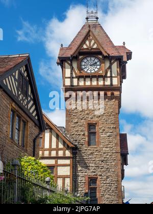 Barrett Browning Institute clock tower and almshouses in foreground at Ledbury Herefordshire England Stock Photo