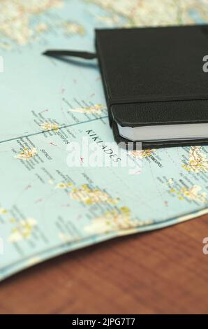 notebook on greek islands map Stock Photo