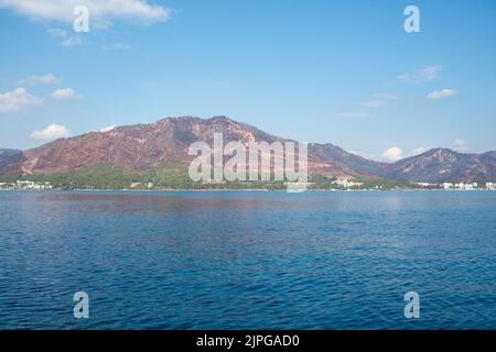 The coast of Turkey near Marmaris city, where the mountains meet the Mediterranean Sea. The shores of Turkey's Mugla province. Mountain hills after bi Stock Photo