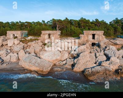 Ruins of bunkers on the beach of the Baltic sea, part of an old fort Stock Photo