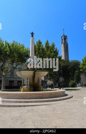 A Fountain and a Modern Church Spire in the center of Montecatini Terme, Tuscany, Italy. Stock Photo