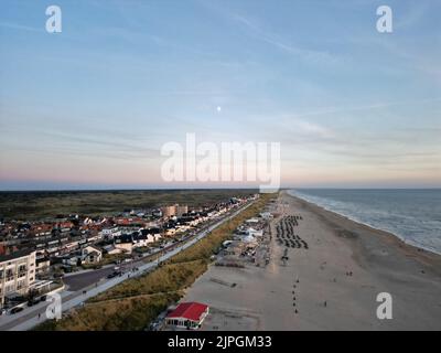 A bird's eye view of houses against a boulevard on Zandvoort beach, the Netherlands at sunset Stock Photo