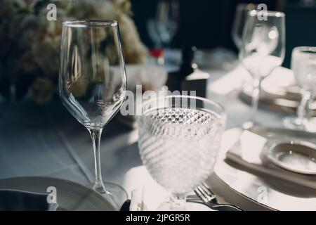 beautiful shape empty wine glass on table in restaurant decor. Stock Photo