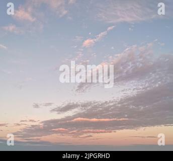 Beautiful sunset sky with some clouds during summer on a nice day Stock Photo