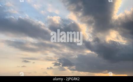 Beautiful sunset sky with some clouds during summer on a nice day Stock Photo
