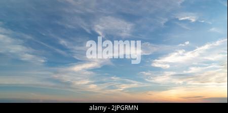 Beautiful sunset sky with some clouds during summer on a nice day Stock Photo