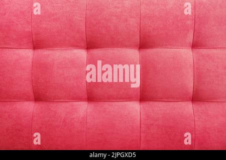 Pink suede leather background for the wall in the room. Interior design, headboards made of furniture fabric, furniture upholstery. Classic checkered Stock Photo