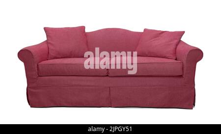 Pink sofa with two pillows isolated on white background. Pink classic style couch with upholstery cover Stock Photo