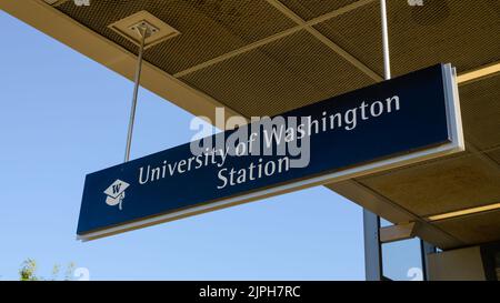 Seattle - August 14, 2022; Hanging sign for University of Washington light rail station in Seattle Stock Photo