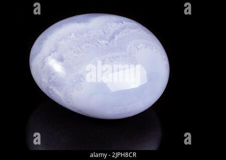 Macro mineral stone blue agate on black background close up Stock Photo