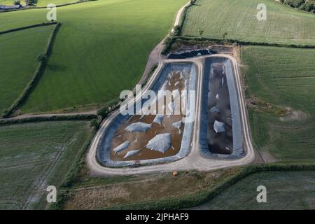 Aerial view of large slurry lagoons with membrane covers to prevent escape of ammonia, methane, carbon dixode, hydrogen sulfide and nitrous oxide Stock Photo