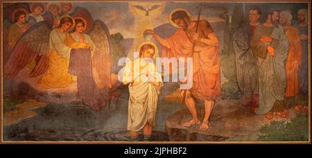 BERN, SWITZERLAND - JUNY 27, 2022: The fresco of Baptism of Jesus in the church Dreifaltigkeitskirche by August Müller (1923). Stock Photo