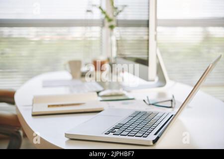 Opened laptop on table of office worker Stock Photo
