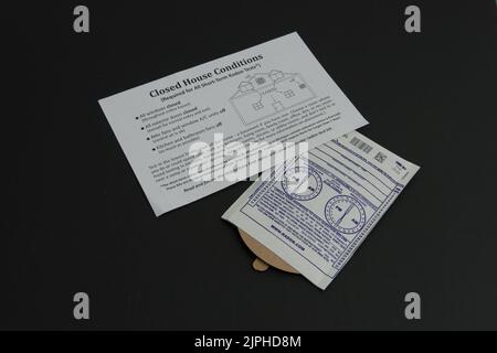An at home radon test kit with the instruction sheet explaining how to do the at home test. Stock Photo