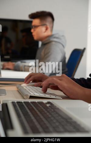 Group of university students using modern computers while having ICT class Stock Photo