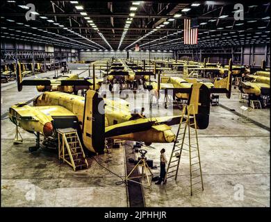 WW2 BOMBER AIRCRAFT PRODUCTION North American B-25 Mitchell production in Kansas City in 1942 Assembling the North American B-25 Mitchell at Kansas City, Kansas (USA)  The North American B-25 Mitchell was an American medium bomber that was introduced in 1941 and named in honor of Major General William 'Billy' Mitchell, a pioneer of U.S. military aviation. Used by many Allied air forces, the B-25 served in every theater of World War II Stock Photo