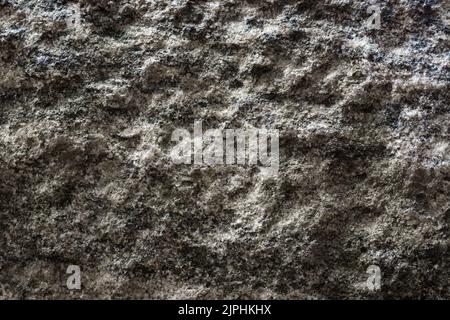 close-up surface of grindstone, abstract of rough light gray natural stone, background textured Stock Photo