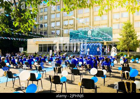 Tbilisi, Georgia - 14th july, 2022: Graduates sit on graduation. Tbilisi state medical university graduation event. Popular study university in caucas Stock Photo