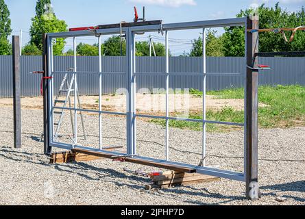Installation of metal gates. Stock Photo