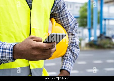Construction Worker Smartphone Call. Contractor Builder Phone Stock Photo