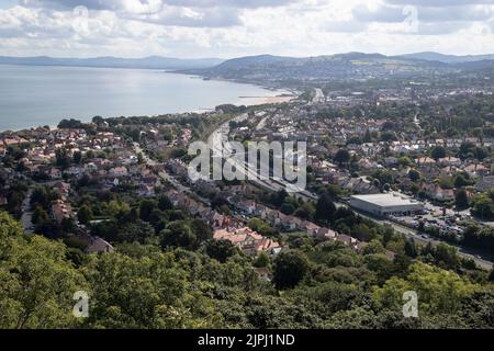 Rhos on Sea and Colwyn Bay with the A55 expressway viewed from the summit of Bryn Euryn a prominent limestone hill overlooking the North Wales vistas Stock Photo