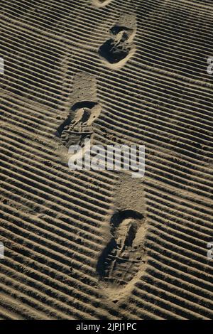 Human footprint on the sandy beach Stock Photo