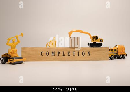 Completion was written on the wooden surface. Personal development and education Stock Photo