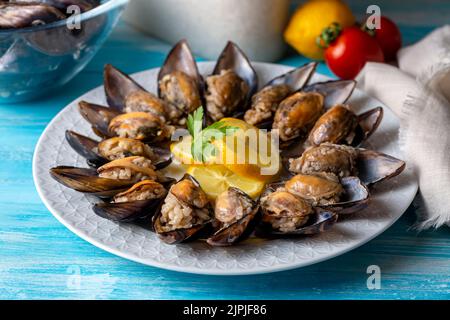 Turkish Street Food Stuffed Mussels with Lemon - Midye Dolma Stock Photo