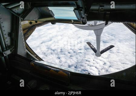 A KC-135 Stratotanker from the 328th Air Refueling Squadron, Niagara Falls Air Reserve Station, N.Y., lowers the refueling boom as it flies over Missouri in preparation for an in-flight refueling mission with the 93rd Bomb Squadron, assigned to the 307th Operations Group at Barksdale Air Force Base, Louisiana, to complete local training requirements August 15, 2022. Establishing, maintaining, and expanding military relationships is vital to mission success, and Barksdale AFB is one of many global partners. (U.S. Air Force photo by Senior Airman Kelsey Martinez) Stock Photo