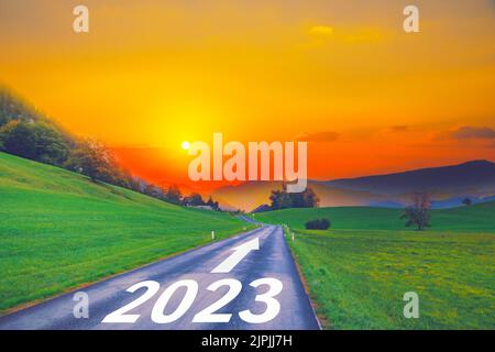 Open empty road path end and new year 2023. Upcoming 2023 goals and leaving behind 2022 year. passing time future, life plan change, work start run li Stock Photo