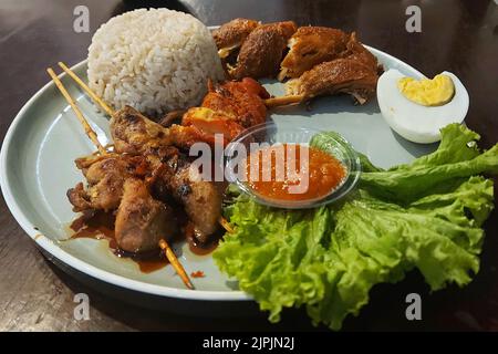 Nasi Campur, Mix Rice, traditional Food, at Cafe Jakarta, Indonesia Stock Photo