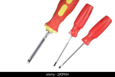 Flat Lay of a close up of screwdrivers and screws isolated on white background Stock Photo