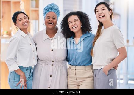 Diverse, happy and smiling portrait of a creative team of designers standing in a modern office. Young successful group of friendly casual coworkers Stock Photo