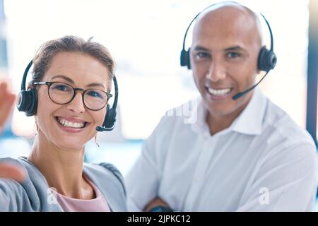 Selfie of call center operator, marketing agent and sales consultants on webcam video call in an office. Friendly, smiling and helpful support staff Stock Photo