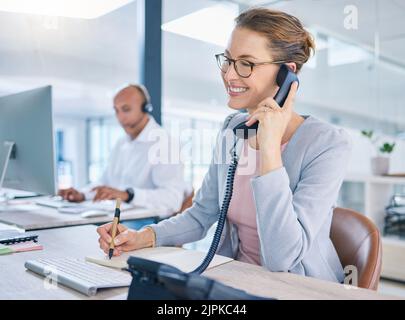 Call center operator, marketing agent and sales consultant networking, talking and consulting on telephone. Friendly secretary, business woman and Stock Photo