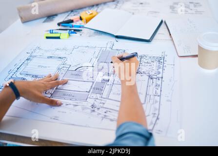 Architect sketching, planning or drawing an architectural design plan or blueprint diagram with draw tools, equipment and stationery. POV hands of man Stock Photo
