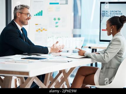 Business analyst, financial advisor and stock trader planning strategy, report and idea with graph, data and information during meeting in office Stock Photo
