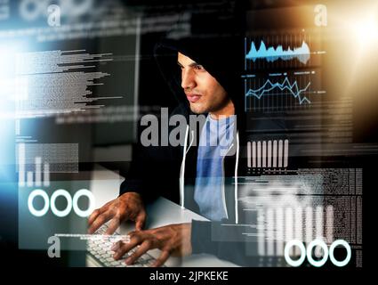 Hes an expert coder. a handsome young male computer programmer working on new code. Stock Photo