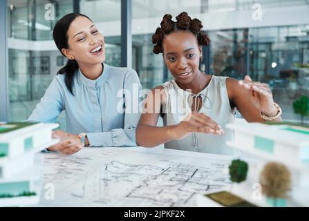 Industrial engineer or architect planning building model design project in an architecture firm. Creative woman designer working on a 3d illustration Stock Photo