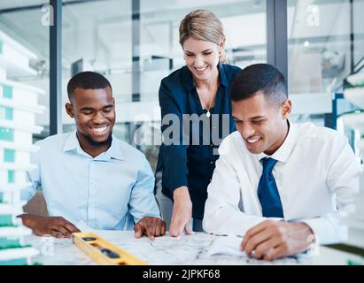 Architects or corporate engineers working on building construction in meeting, planning blueprint and looking at home renovation paperwork. Smiling Stock Photo